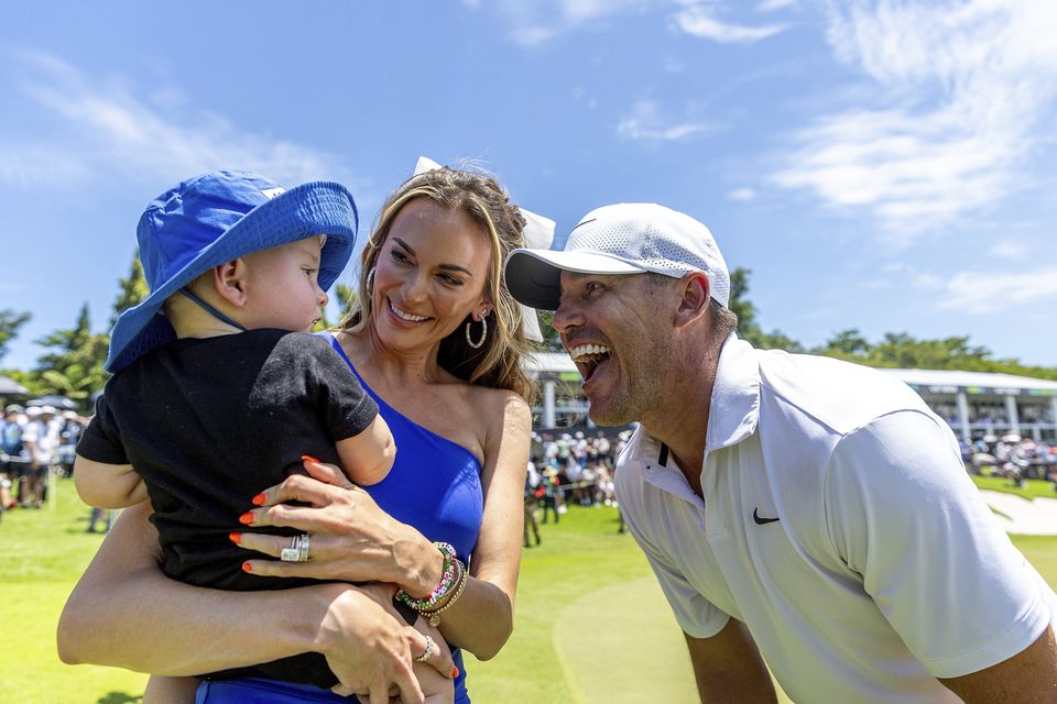 Brooks Koepka celebrates with his family after winning the LIV Golf event in Singapore (Jon Ferrey/LIV Golf via AP)