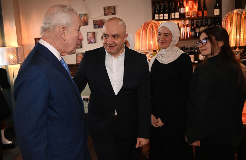 The King with Imad Eddin Al Arnab, Syrian Kitchen founder, as he meets members of the British Syrian community (Eddie Mulholland/Daily Telegraph/PA)