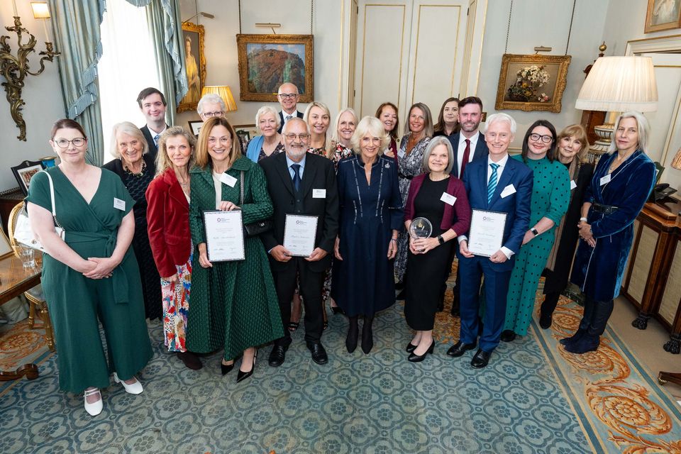 The Queen poses with award winners and guests during the reception (Aaron Chown/PA)