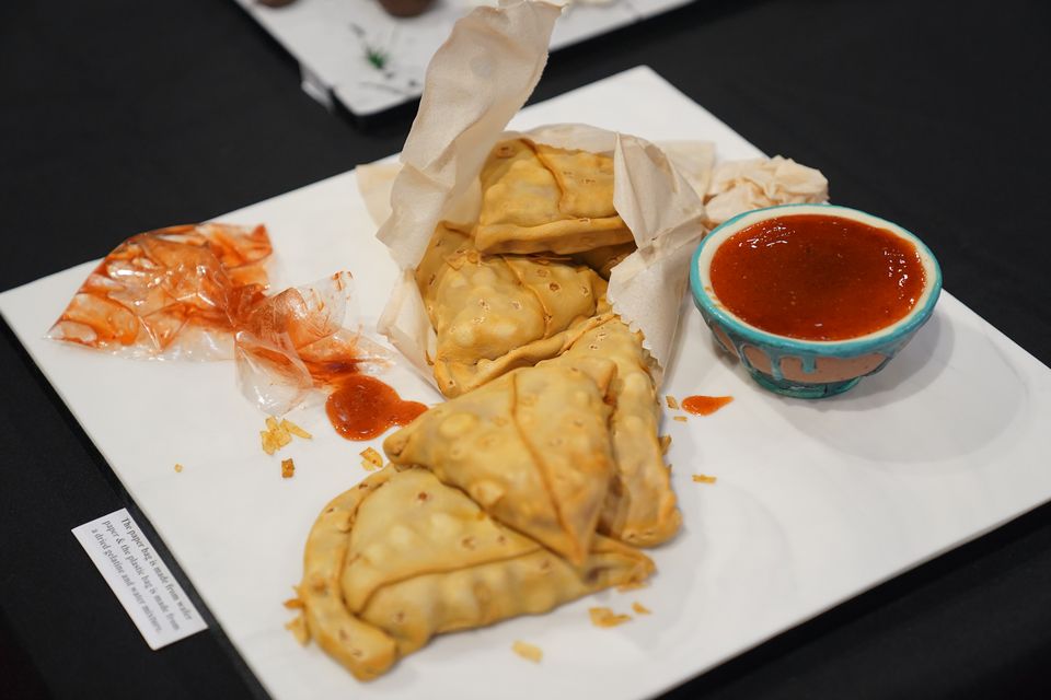 A cake depicting a selection of samosas and a dip (Jacob King/PA)