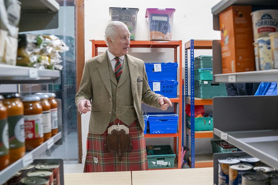 Charles surveyed the stock in the food bank (Jane Barlow/PA)