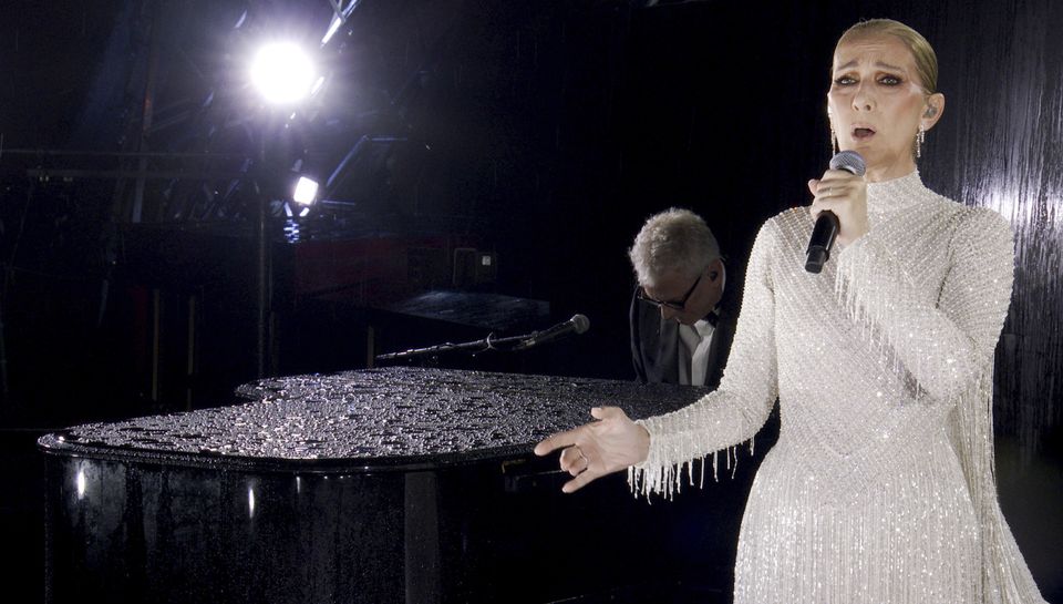 Celine Dion performing at the Eiffel Tower (Olympic Broadcasting Services/PA)