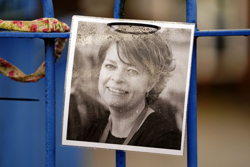 A photograph of Ruth Perry attached to the fence outside John Rankin Schools in Newbury (Andrew Matthews/PA)