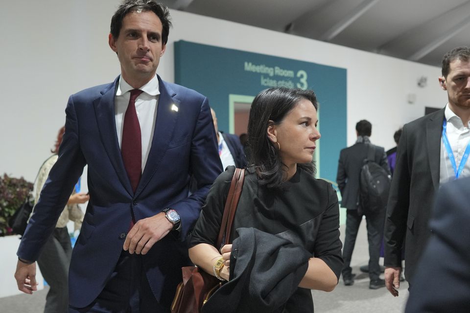 Wopke Hoekstra, EU climate commissioner, left, and Germany’s foreign minister Annalena Baerbock have been involved in the talks (Peter Dejong/AP)