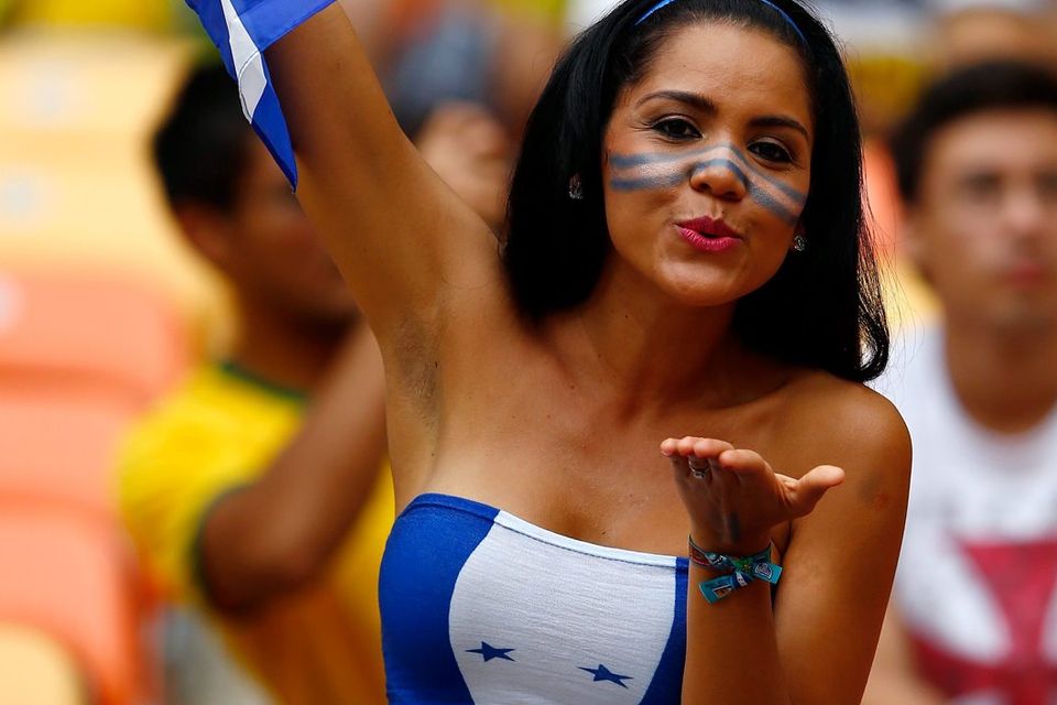 The beautiful game - football fans from around the world -  A Honduras fan shows hher support prior to the 2014 FIFA World Cup Brazil Group E match between Honduras and Switzerland at Arena Amazonia on June 25, 2014 in Manaus, Brazil.  (Photo by Matthew Lewis/Getty Images)