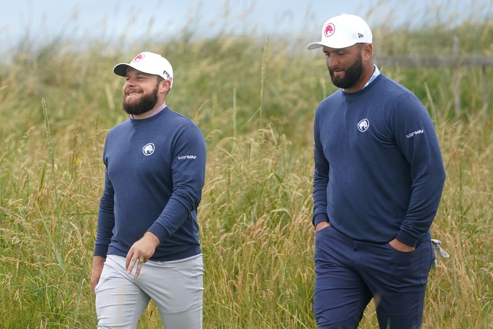 Tyrrell Hatton, left, and Jon Rahm are appealing against their fines for playing LIV Golf events without permission (Owen Humphreys/PA)