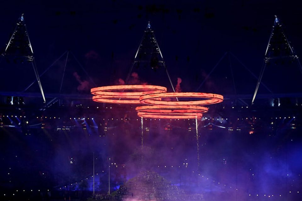 LONDON, ENGLAND - JULY 27:  Rings representing both the Olympics and the Industrial Revolution are lit during the Opening Ceremony of the London 2012 Olympic Games at the Olympic Stadium on July 27, 2012 in London, England.  (Photo by Clive Rose/Getty Images)