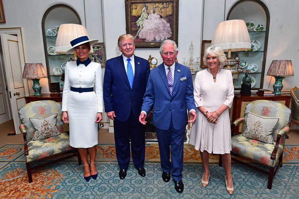 Donald Trump and his wife Melania (left) at Clarence House to take tea with the then Prince of Wales and Duchess of Cornwall (Victoria Jones/PA)