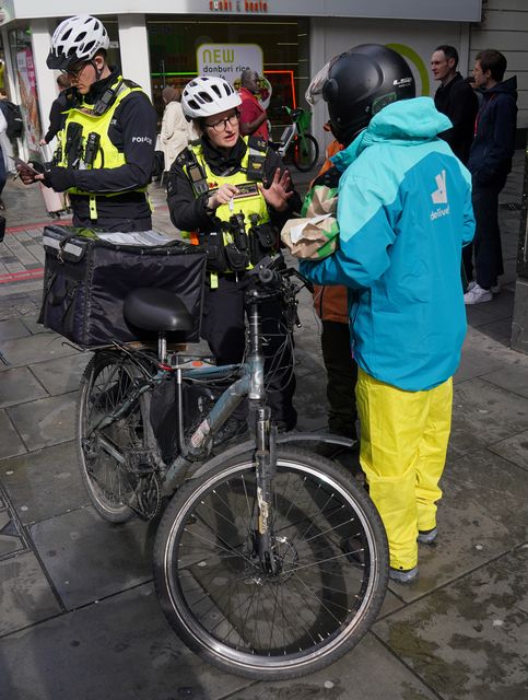 E-bikes are a common form of transport for food delivery workers (Jonathan Brady/PA)