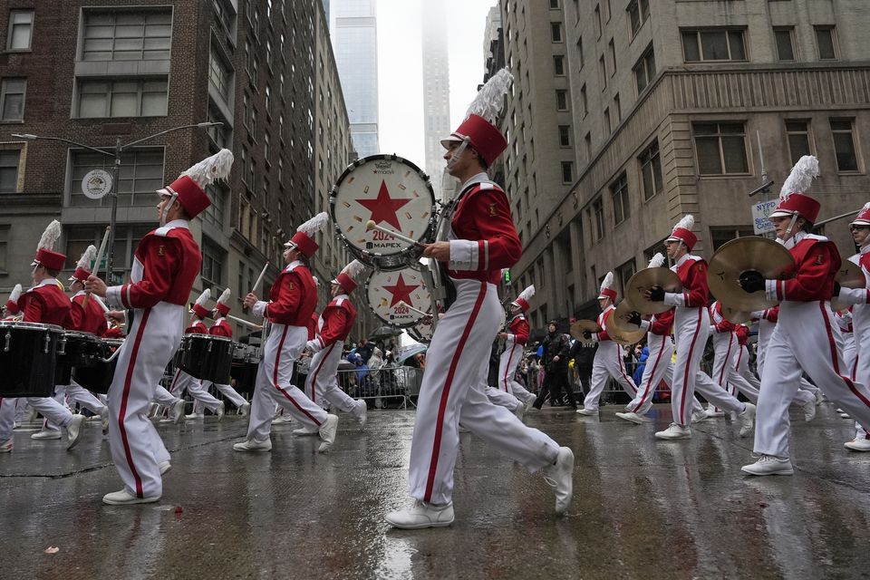 The Macy’s Great American Marching Band plays as it heads down Sixth Avenue (Julia Demaree Nikhinson/AP)