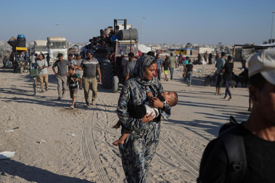 Palestinians fleeing the Khan Younis area (Abdel Kareem Hana/AP)