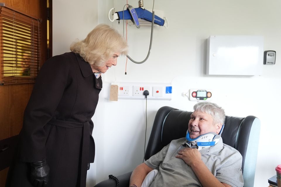 Queen Camilla speaks to patient Christopher Southall (Jacob King/PA)