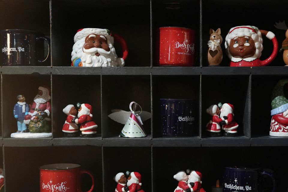 Christmas mugs and decorations on sale in a store in Bethlehem. Tourism accounts for an estimated 70% of Bethlehem’s income and the cancellation of the Christmas festivities has hit the economy hard (AP Photo/Luis Andres Henao)