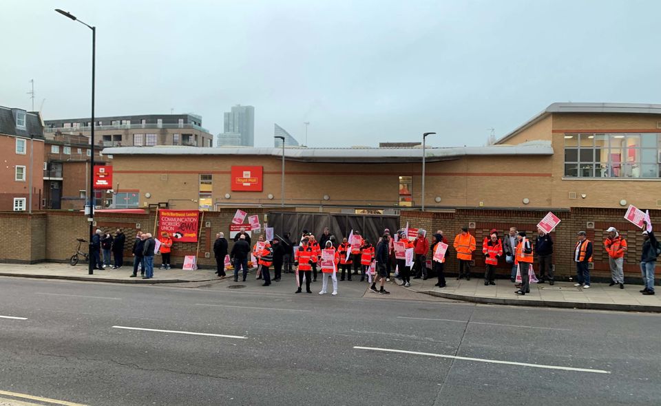Striking postal workers outside the Royal Mail Islington Delivery Office in north London, last year (Lucas Cumiskey/PA)