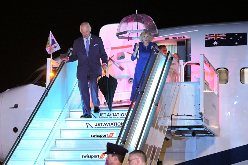 Charles and Camilla arrive in Sydney just after a torrential shower (Victoria Jones/PA)