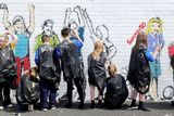 thumbnail: Children from a local school painting a new mural in the lower Shankill area