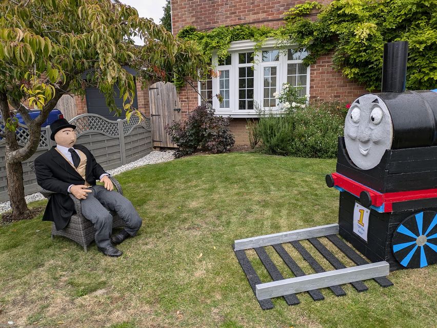 Scarecrow called ‘Off the Rails’ (Great Paxton Scarecrow Festival/PA)