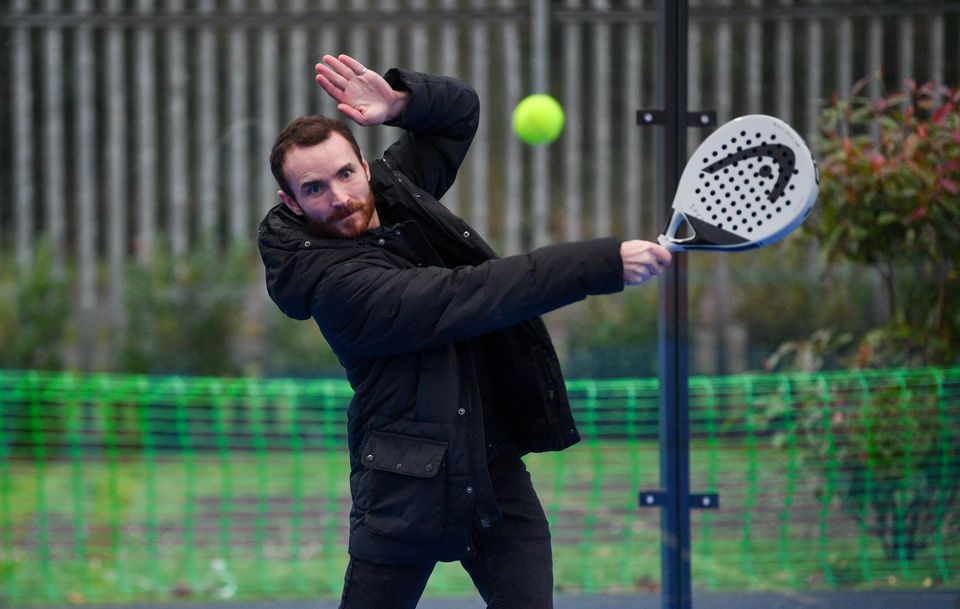 Cast member Martin McCann practices swinging the bat.