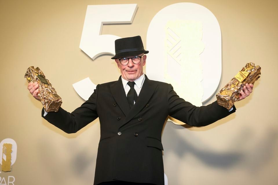 Jacques Audiard poses after receiving awards for Emilia Perez (Thomas Padilla/AP)