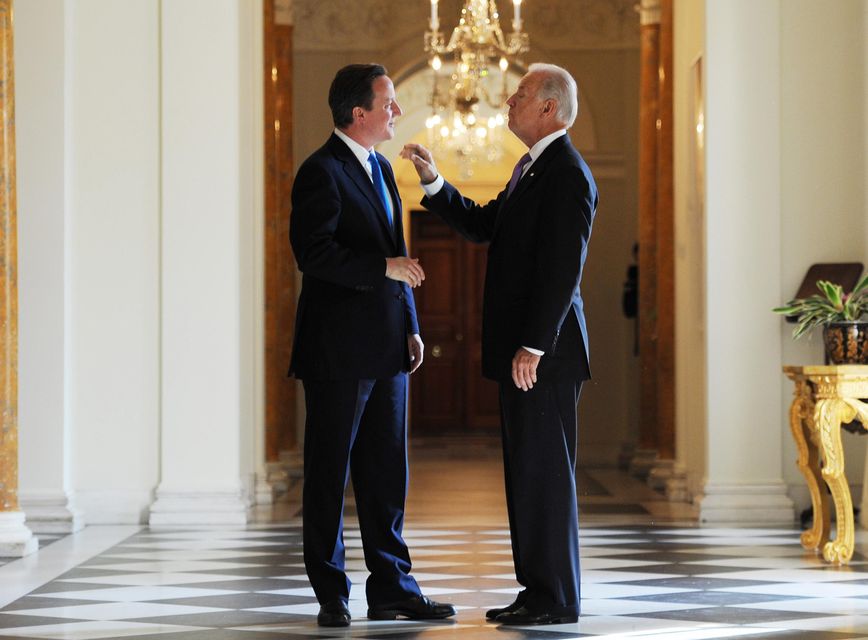 Britain’s then prime minister David Cameron greets then US vice president Joe Biden at the British Residence in Washington (Stefan Rousseau/PA)