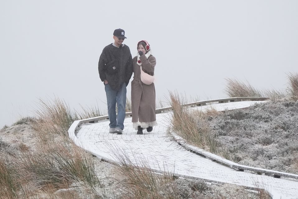 People out walking at the Wicklow Gap mountain pass in Co Wicklow as Ireland enters a cold snap (Niall Carson/PA)