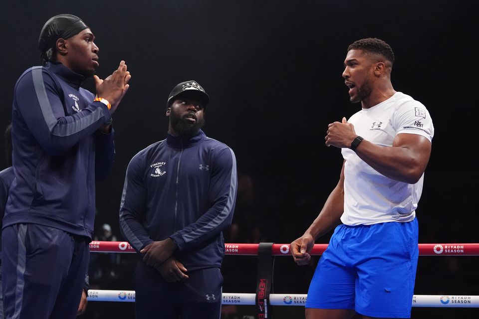 Joshua (right) with members of the Finchley Boxing Club (Bradley Collyer/PA)