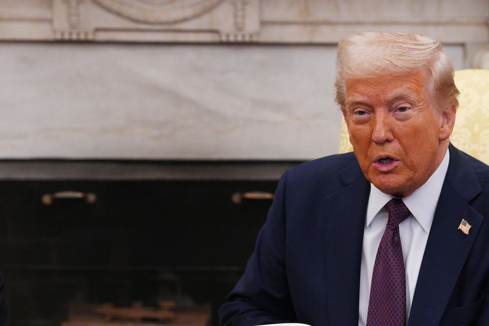 US President Donald Trump is presented with a letter from the King (Carl Court/PA)