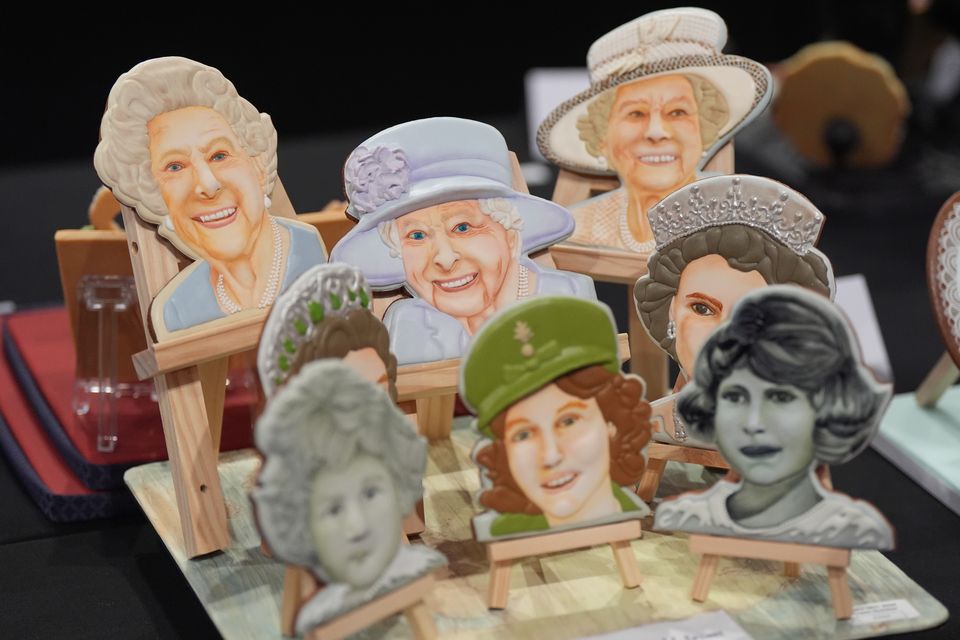 A cake depicting Queen Elizabeth II through the years (Jacob King/PA)