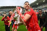 thumbnail: Cliftonville striker Joe Gormley savours his moment with the Irish Cup following the Final victory over Linfield
