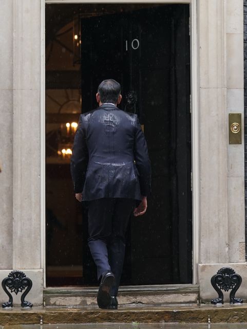 Rishi Sunak walks back in to 10 Downing Street after calling an election (Stefan Rousseau/PA)