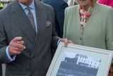 thumbnail: Britain's Prince Charles, Prince of Wales (L) and his wife Camilla, Duchess of Cornwall (R) hold a photograph of the boat Shadow V, the boat on which the prince's great-uncle Lord Mountbatten was killed in an IRA bombing in 1979,  presented to the prince by Pat Markeyira during a visit to the village of Mullaghmore in Ireland on May 20, 2015 the scene of the 1979 bomb. Britain's Prince Charles spoke of his "anguish" at the murder of his godfather by IRA paramilitaries in 1979 as he became the first royal to visit the assassination site in Ireland.  Charles remembered Lord Louis Mountbatten as "the grandfather I never had" on an emotional trip to the rugged coastline, saying he understood the suffering of the Irish people in "a profound way".  Peter McHugh helped with the rescue effort in the aftermath of the 1979 attack.  AFP PHOTO / POOL / ARTHUR EDWARDSARTHUR EDWARDS/AFP/Getty Images