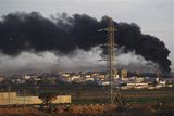 thumbnail: Smoke rises after an Israeli bombing in the Gaza Strip, as seen from the Israeli side of the border between southern Israel and the Gaza Strip, Thursday Jan. 15, 2009. Israeli forces shelled the United Nations headquarters in the Gaza Strip on Thursday, setting the compound on fire as U.N. chief Ban Ki-moon was in the area on a mission to end Israel's devastating offensive against the territory's Hamas rulers. Ban expressed "outrage" over the incident.(AP Photo/Sebastian Scheiner)