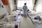 thumbnail: CORRECTS WHOLE CAPTION - Patients at a hospital wait to be evacuated without medicine and electricity in Otsuchi in Iwate Prefecture (state) Sunday, March 13, 2011, two days after a strong earthquake and tsunami hit northeastern Japan. (AP Photo/The Yomiuri Shimbun, Yasuhiro Takami)  JAPAN OUT, CREDIT MANDATORY