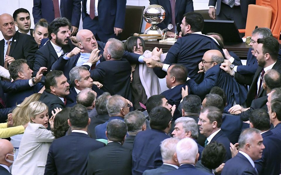 MPs scuffle in parliament (DIA Images/AP)