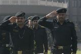 thumbnail: National Security Guard commandoes pay tribute to commando Gajendra Singh, in New Delhi, India, Saturday, Nov. 29,  2008. Indian commandos killed the last remaining gunmen holed up at a luxury Mumbai hotel Saturday, ending a 60-hour rampage through India's financial capital by suspected Islamic militants that killed people and rocked the nation. (AP Photo/Mustafa Quraishi)
