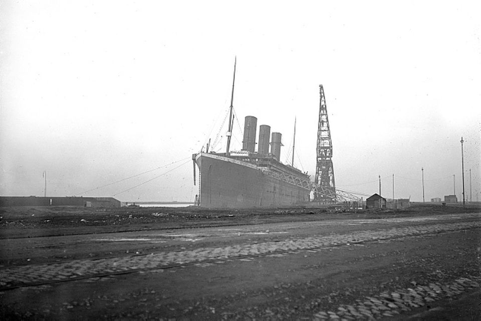 Titanic at fitting-out wharf with three out of four funnels fitted. Photograph © National Museums Northern Ireland. Collection Ulster Folk & Transport Museum