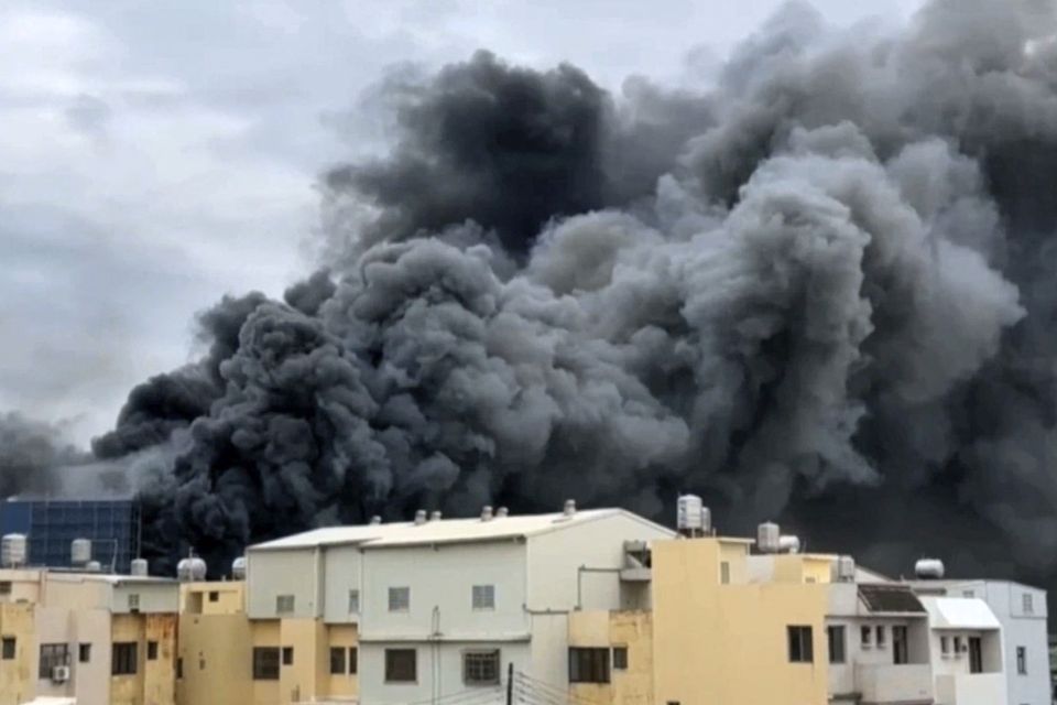 Smoke rises from a building in central Taiwan (EBC via AP)