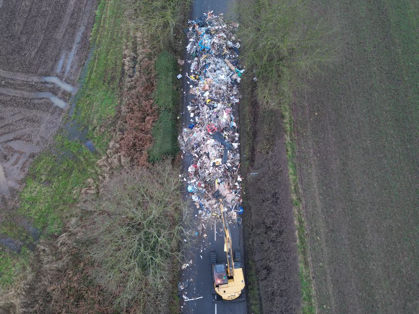 The waste being removed by council contractors (Phil Barnett/PA)