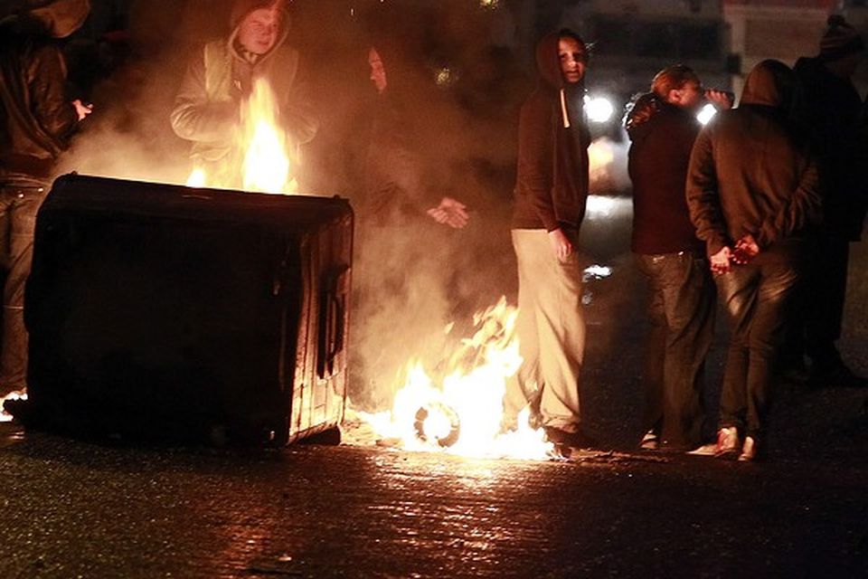 A burning barricade on the Newtownards road area of Belfast, where police have been targeted by rioters