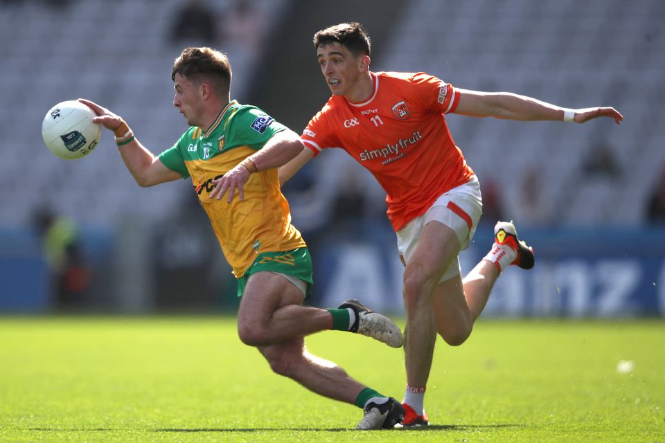 Armagh's Rory Grugan tackles Peadar Mogan of Donegal during the 2024 Division Two Final between the sides