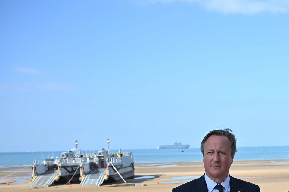 (Left to right) Foreign Secretary Lord David Cameron, French President Emmanuel Macron, German Chancellor Olaf Scholz and US President Joe Biden attending the D-Day 80 International Ceremony at Omaha Beach, Normandy (Abaca Press/Alamy Stock/PA)