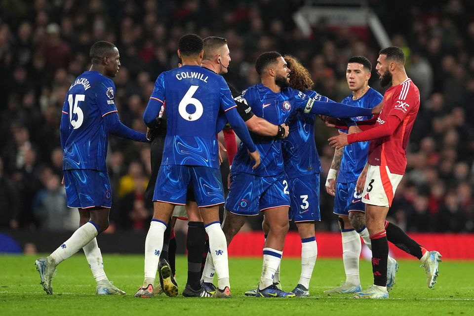 Noussair Mazraoui faces off with Chelsea’s players (Martin Rickett/PA)