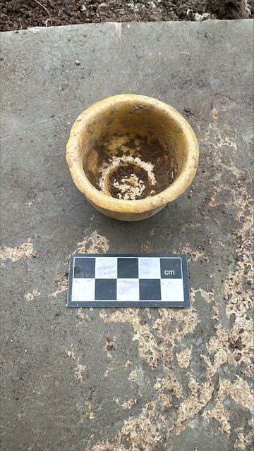 An intact piece of pottery found on the site (Michael Fearon/PA).