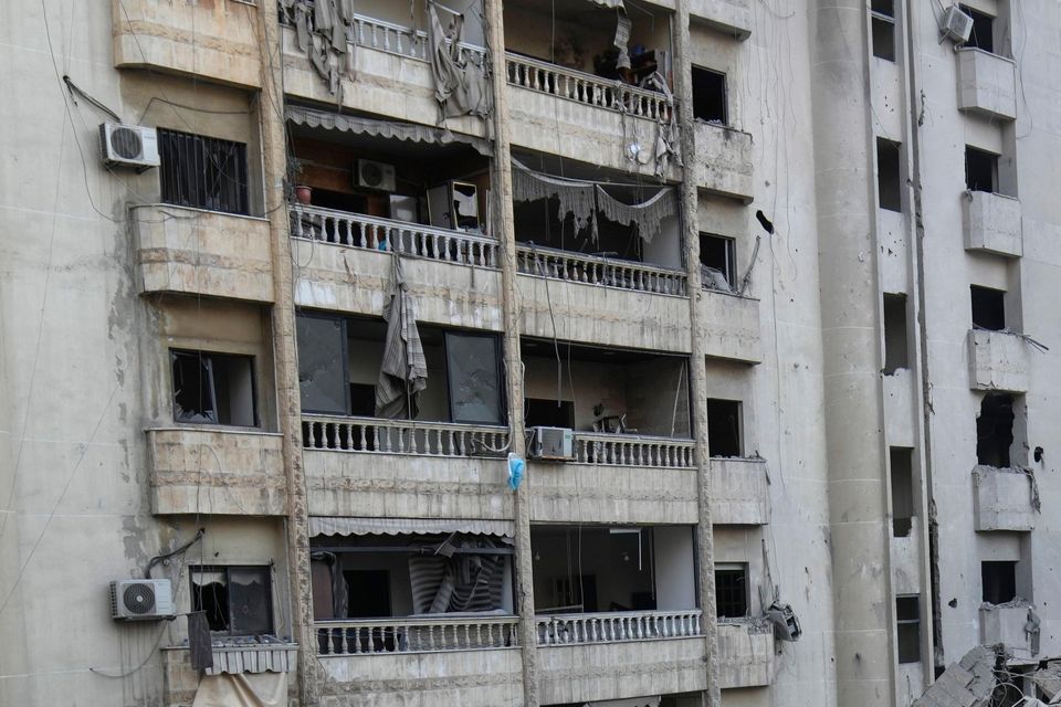 Smoke rises from a destroyed building hit by an Israeli airstrike on Dahiyeh (Hussein Malla/AP)