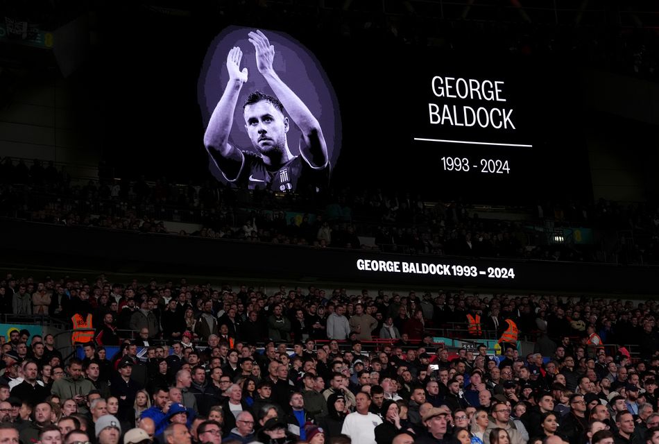 A tribute to George Baldock on the big screen at Wembley (Adam Davy/PA)