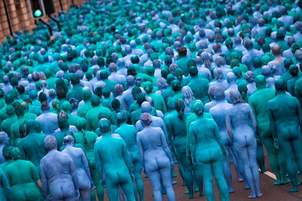 Naked volunteers, painted in blue to reflect the colours found in Marine paintings in Hull's Ferens Art Gallery, participate in US artist, Spencer Tunick's "Sea of Hull" installation in Kingston upon Hull on July 9, 2016. AFP/Getty Images