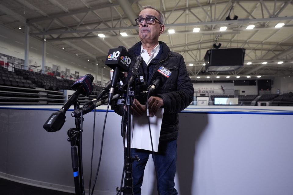 Doug Zeghibe, of the Skating Club of Boston, pauses while announcing that six athletes, coaches and family are believed to have perished in the air crash (Charles Krupa/AP)