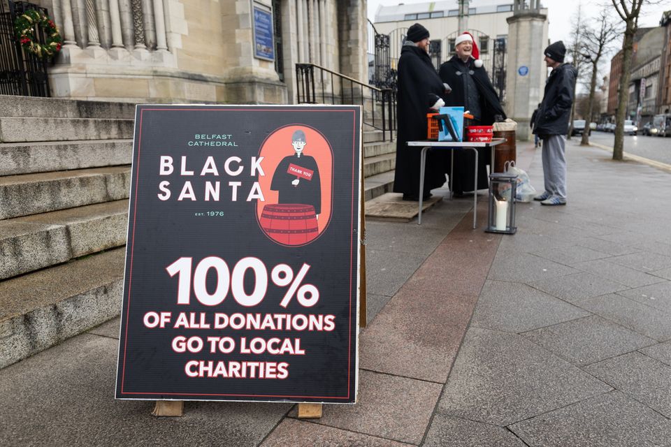 Black Santa outside St Anne’s Cathedral, Belfast. Pic: Luke Jervis/Belfast Telegraph