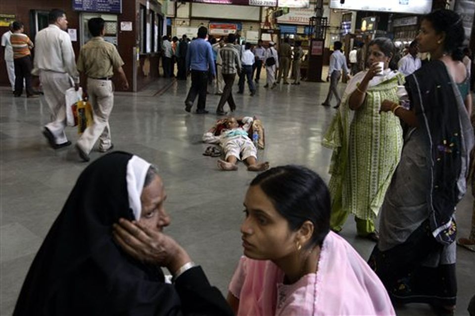 Passengers wait for their respective trains at Chhatrapati Shivaji railroad station, where the terror attacks began on Wednesday with shooters spraying gunfire,  in Mumbai, India, Saturday, Nov. 29, 2008. Indian commandos killed the last remaining gunmen holed up at a luxury Mumbai hotel Saturday, ending a 60-hour rampage through India's financial capital by suspected Islamic militants that killed people and rocked the nation. (AP Photo/Altaf Qadri)
