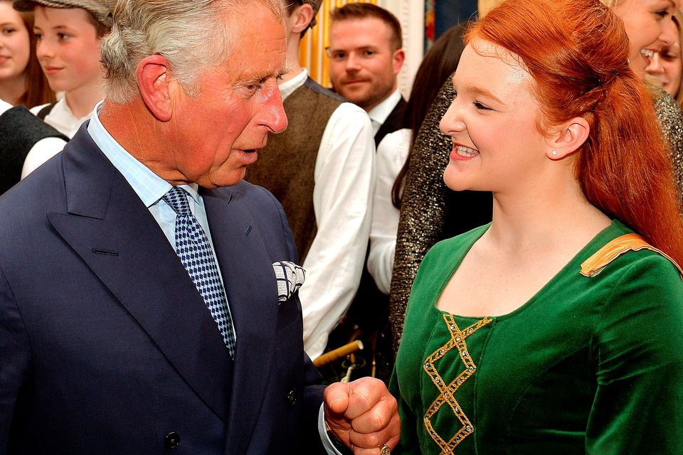 The Prince of Wales talks with a dancer during a reception and  concert featuring performers from Northern Ireland at Hillsborough Castle, in Belfast, Northern Ireland.